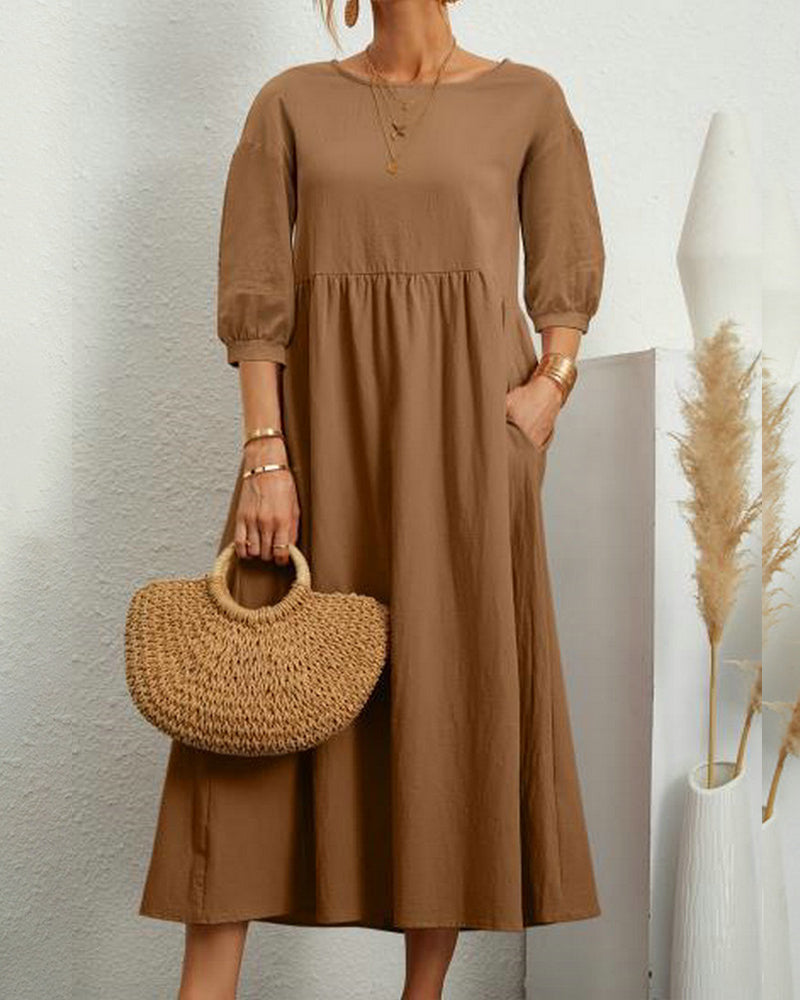Relaxed fit women's midi dress featuring a round neck, elegant lantern sleeves, perfect for casual outings.
