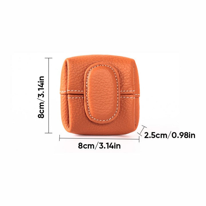 Mini brown leather coin wallet on a rustic wooden surface, highlighting its elegance