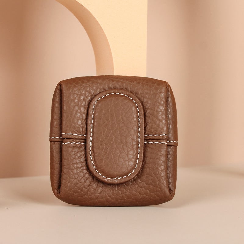 Women's mini olive green leather coin purse, a chic and understated accessory