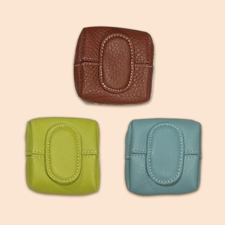 Mini green leather coin purse with a secure snap closure, alternative design