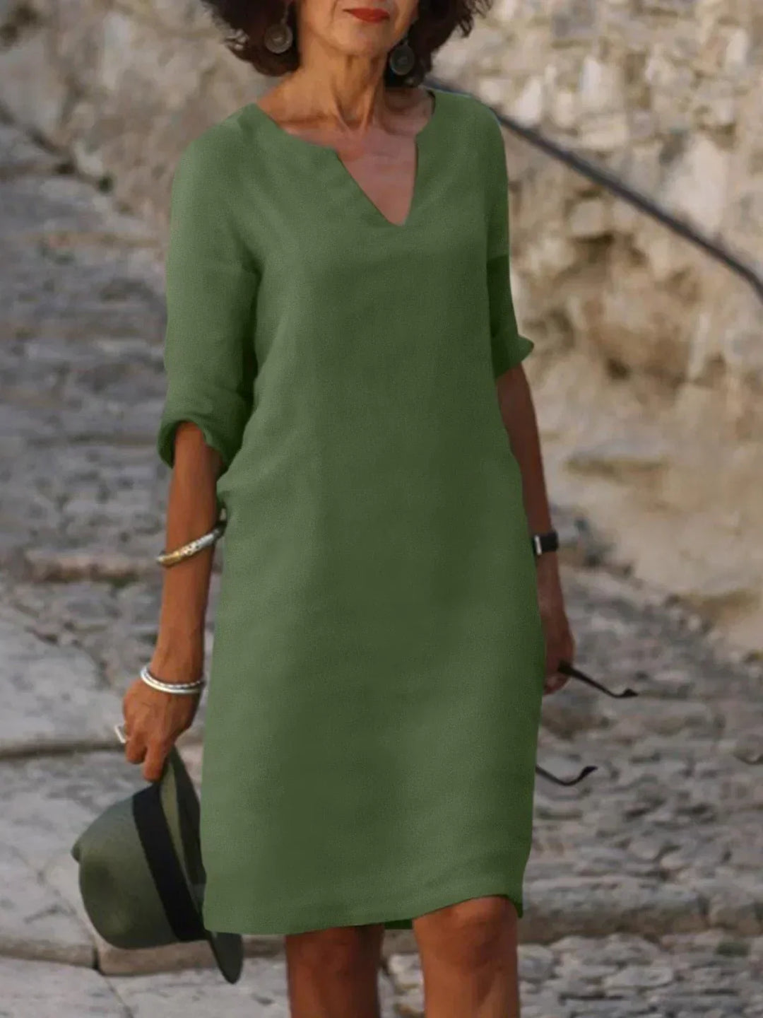 Elegant women's 3/4 sleeve V-neck mini dress, comfortable & stylish for everyday occasions.