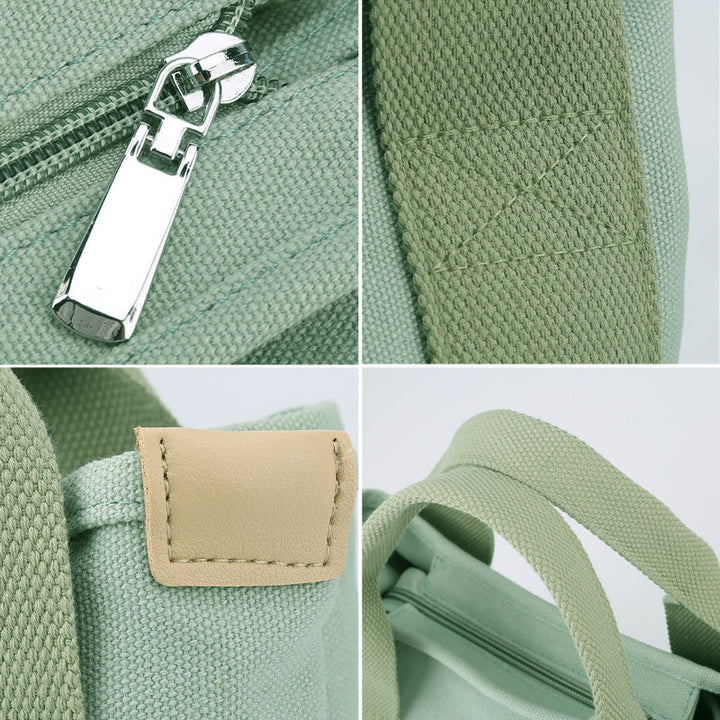 The interior of a women's canvas bag, revealing multiple compartments and pockets for organization