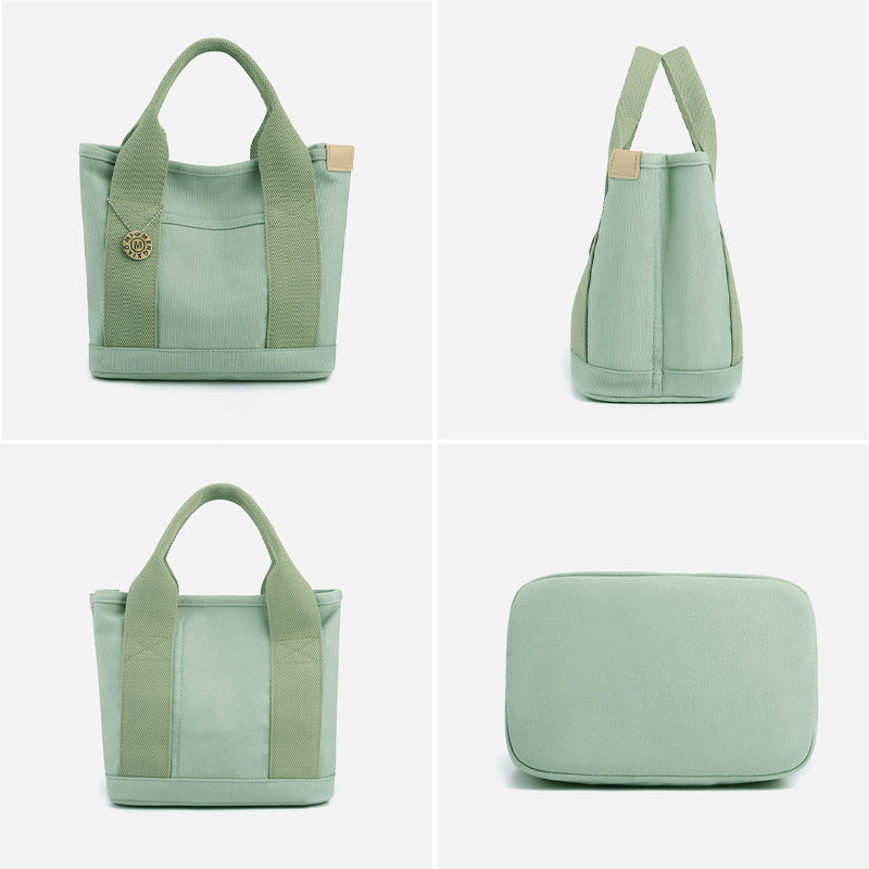 Women's casual multi-pocket canvas shoulder bag, modelled on a person for scale
