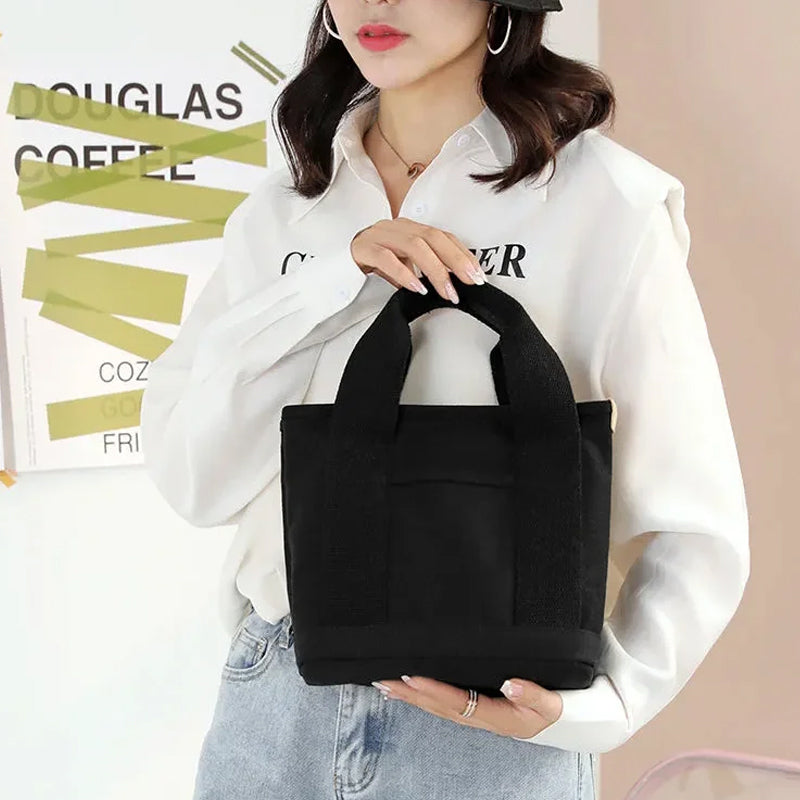 Collection of small items neatly arranged in the pockets of a women's canvas multi-pocket bag