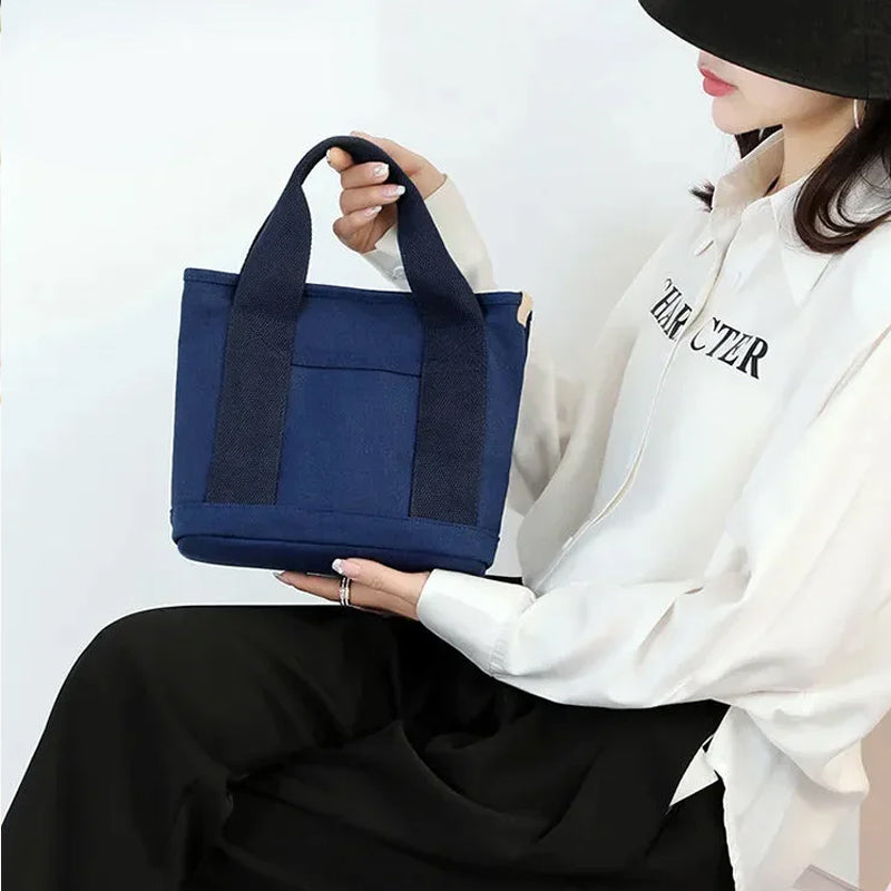 Women's multi-pocket canvas handbag in a vibrant color, offering style and utility