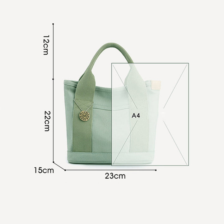 A women's canvas multi-pocket shoulder bag, ideal for busy individuals, shown empty