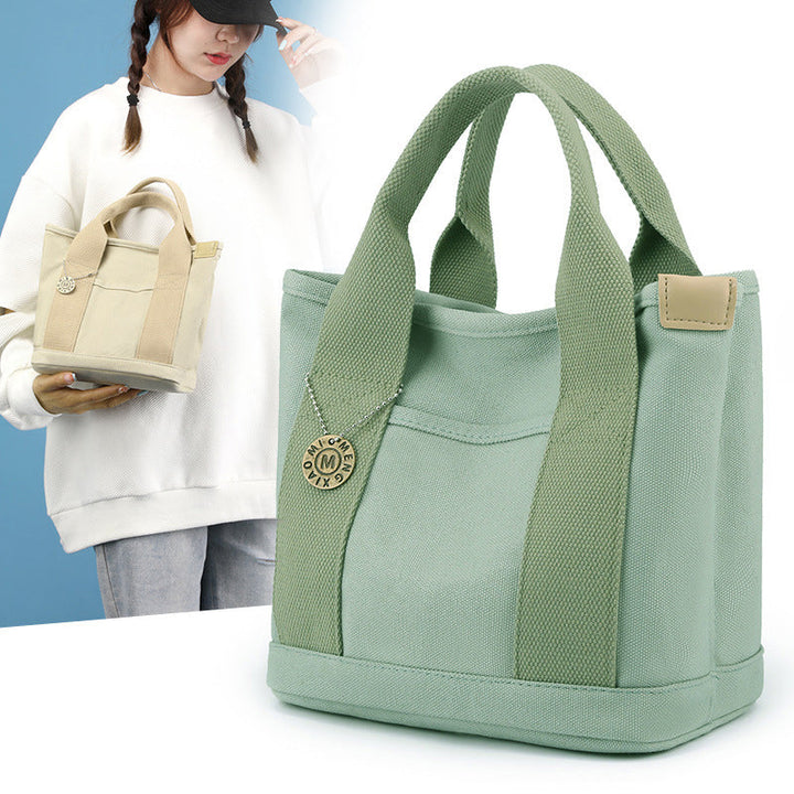 Side profile of the women's multi-pocket canvas bag, highlighting its generous capacity