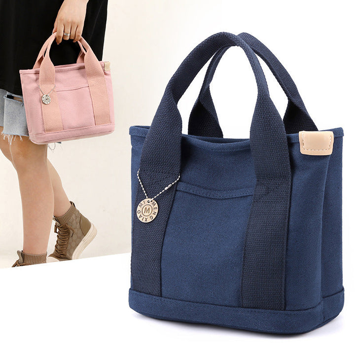 Everyday elegance: a women's canvas multi-pocket handbag captured in natural light