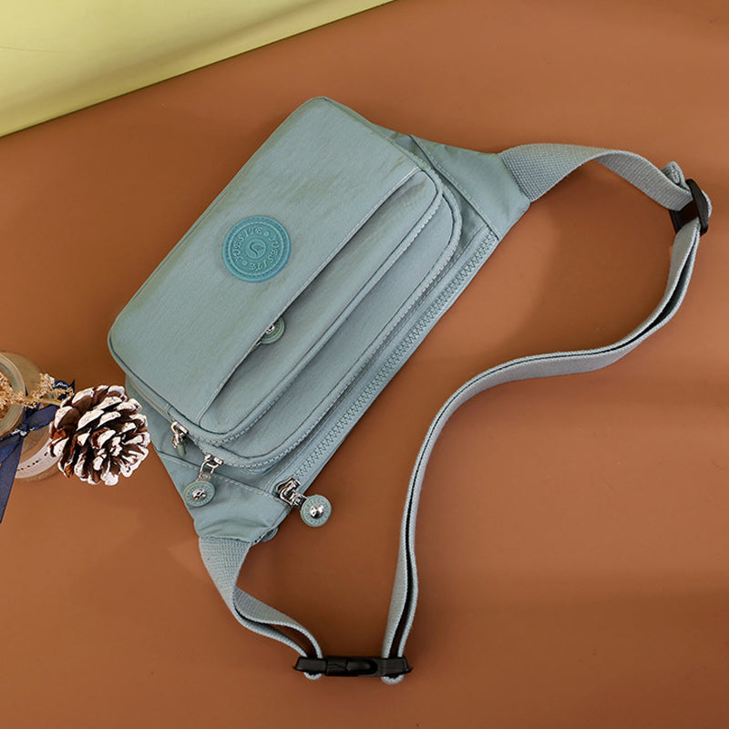 Detail of the multi-pocket organization inside a women's nylon travel crossbody bag