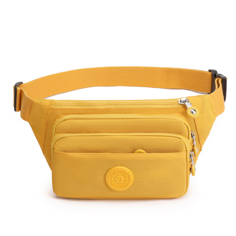 Lightweight black nylon crossbody bag, a compact multi-pocket solution for women