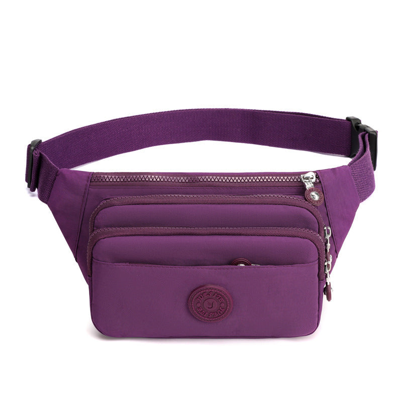 Close-up of the smooth zipper pulls on a women's lightweight nylon crossbody travel bag