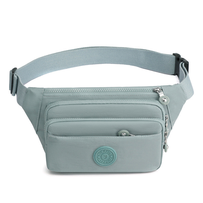 Spacious interior of a women's multi-pocket nylon crossbody bag, showing its capacity