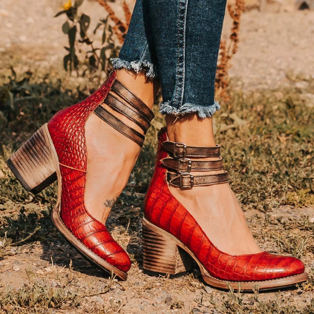 Women's elegant multi-strap block heel ankle boots; a stylish addition to your fall/winter wardrobe.