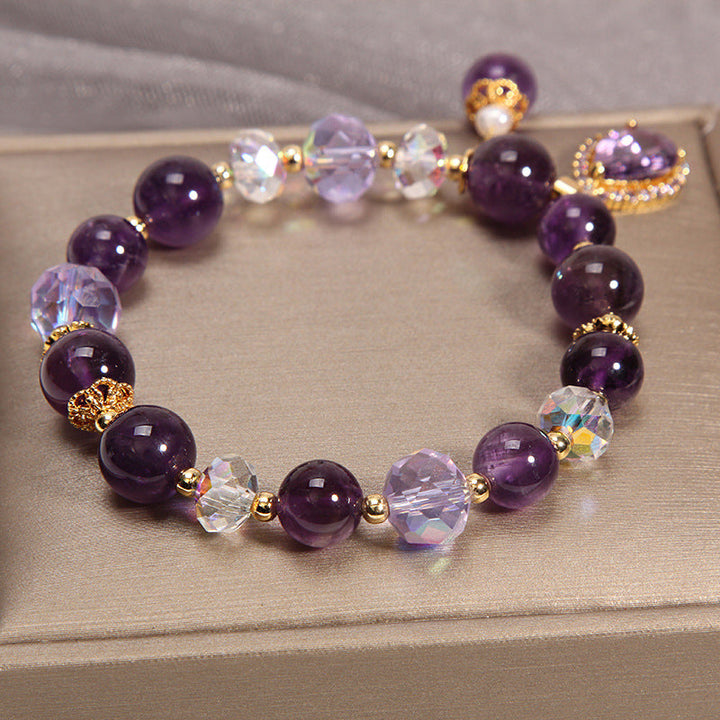 Close-up of women's amethyst water drop bracelet, showing crystal clarity and color