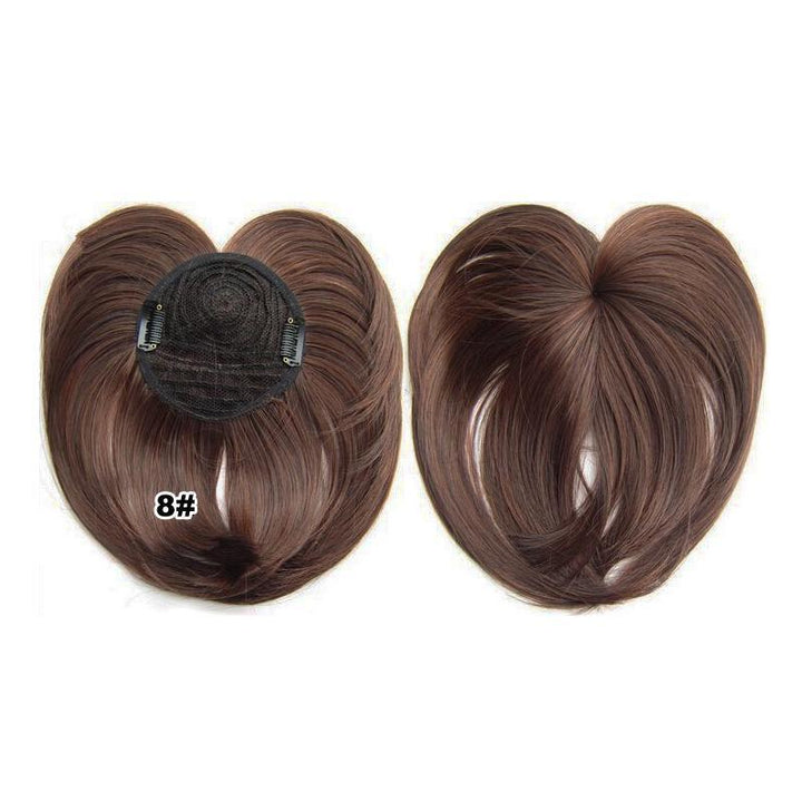 Close-up of a women's short hair topper, showing natural texture and color, synthetic fibers