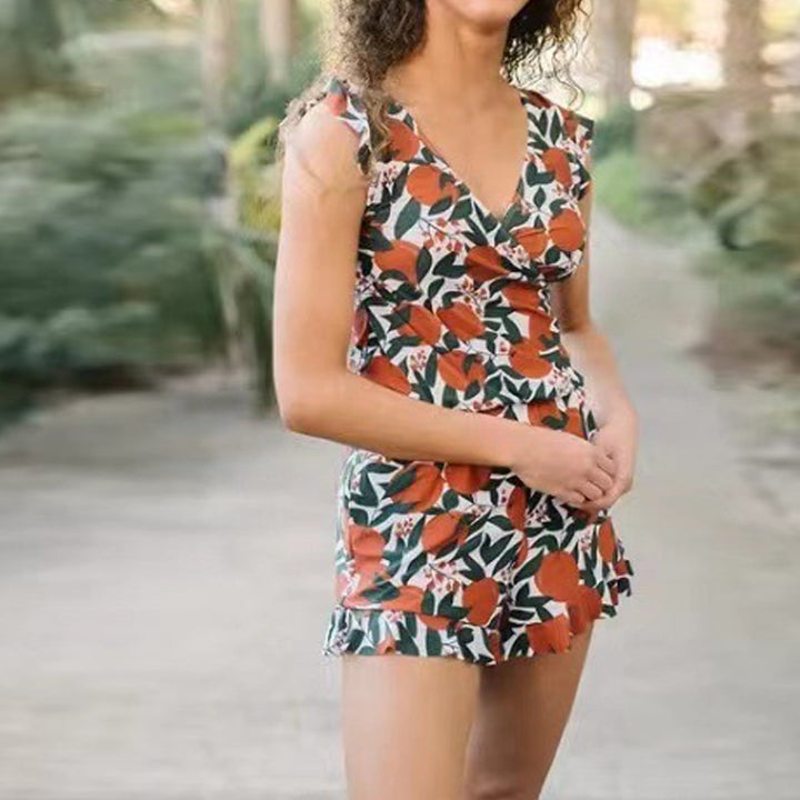 Women's navy swim romper with built-in bra, quick-dry fabric, ideal for beachwear or summer fashion.