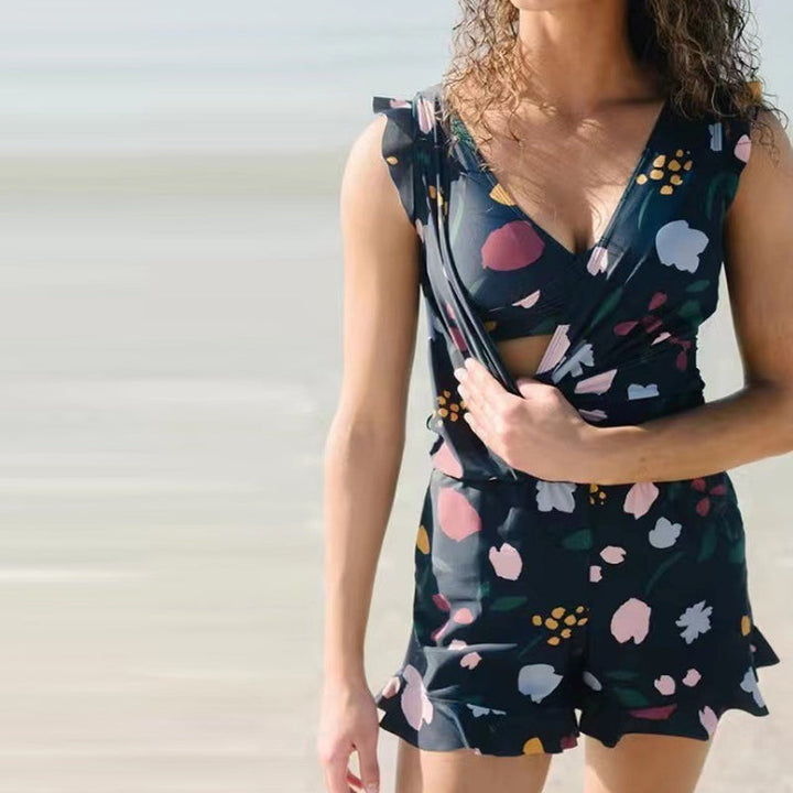 Quick-dry women's swim romper in black, featuring a built-in bra for support, perfect one-piece swimwear.