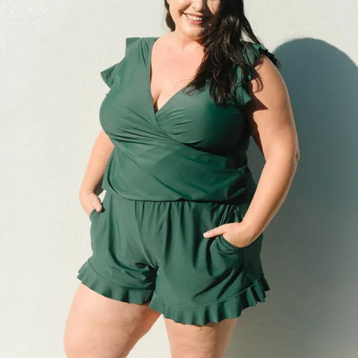 Purple polyester swim romper for women, with integrated bra, stylish and practical for summer beachwear.