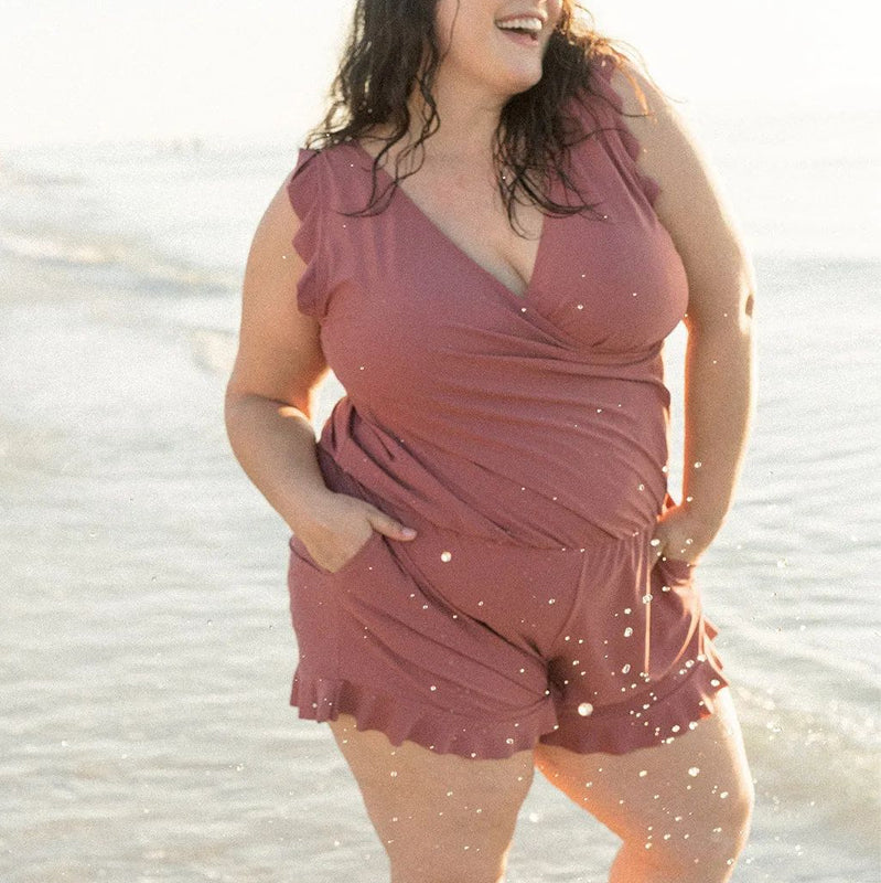 Close-up of the quick-dry fabric on a women's swim romper, highlighting the quality polyester material.