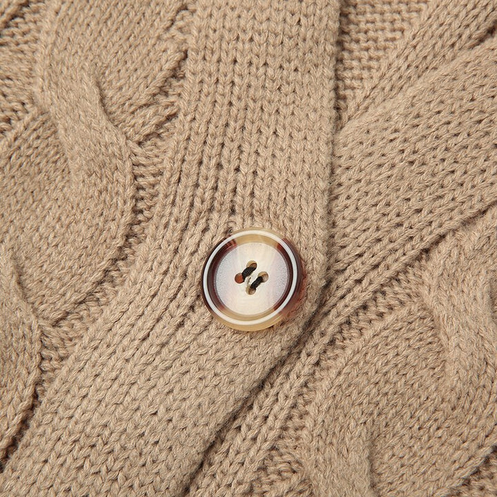 Warm winter layer: Noelle women's long knitted cardigan with spacious pockets and a chic button front.