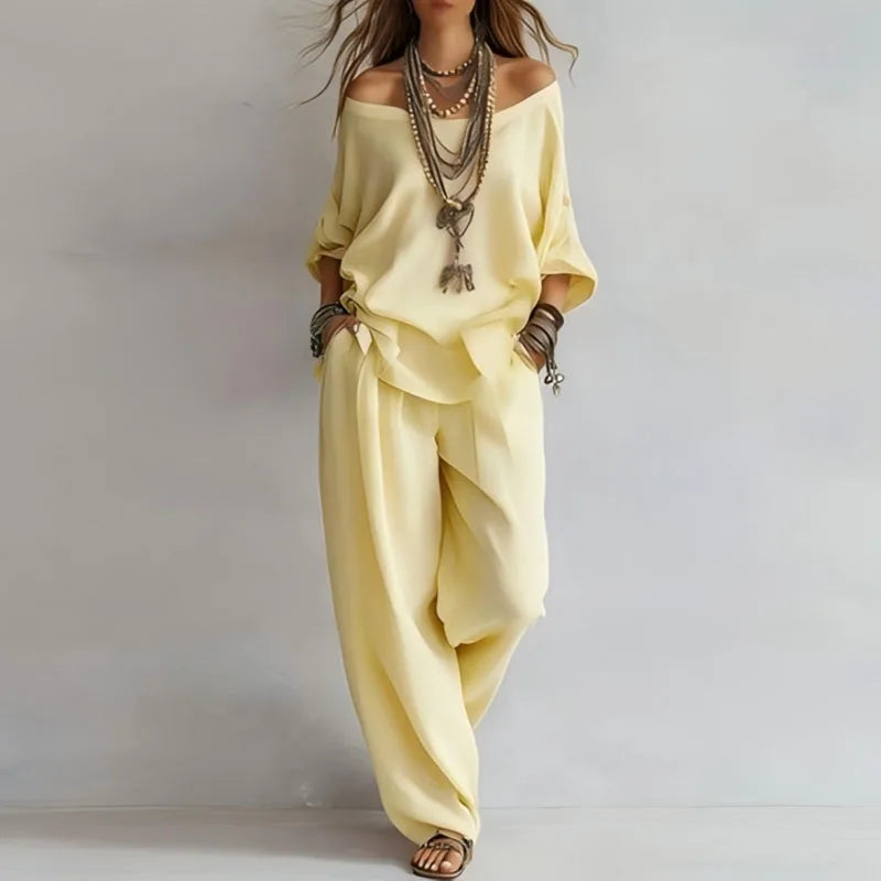 Stylish women's off-shoulder matching set. Chic two-piece outfit with wide leg pants for effortless summer wear.