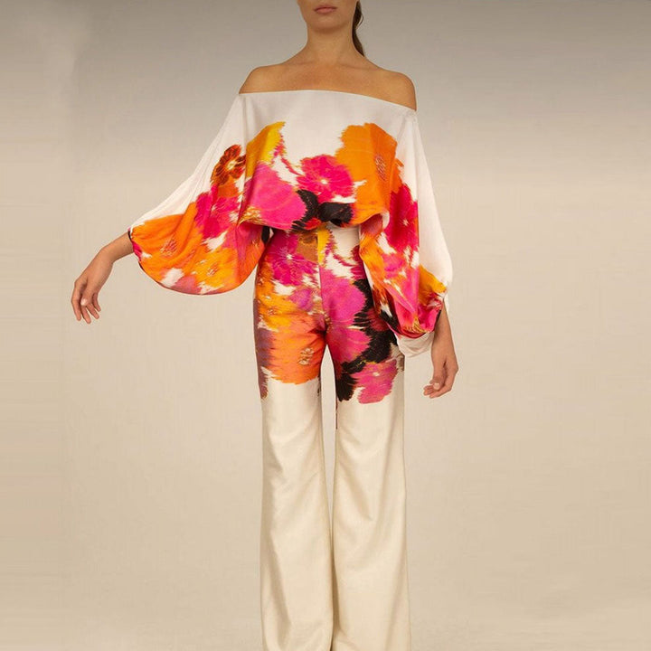 Woman modeling a chic off-shoulder printed summer two-piece set, ideal for warm weather.