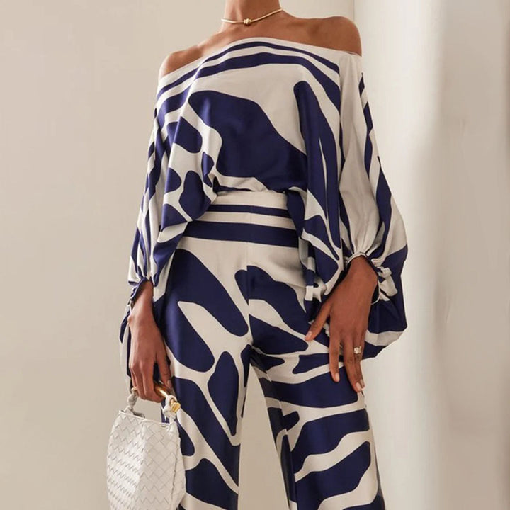 Matching printed shorts with a comfortable fit for women's off-shoulder summer two-piece set.