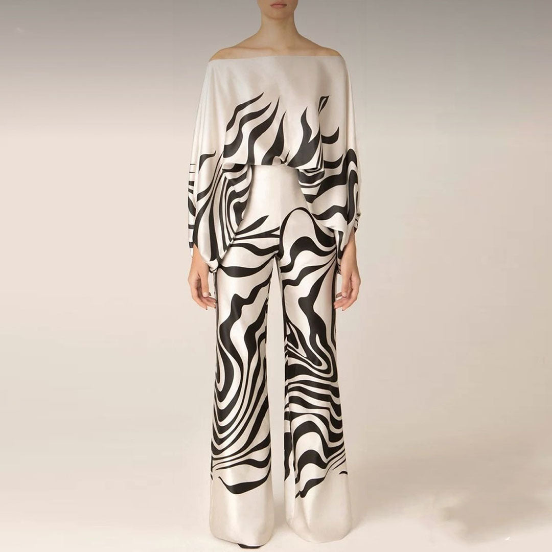 Complete women's off-shoulder summer two-piece set in a stylish, eye-catching print.