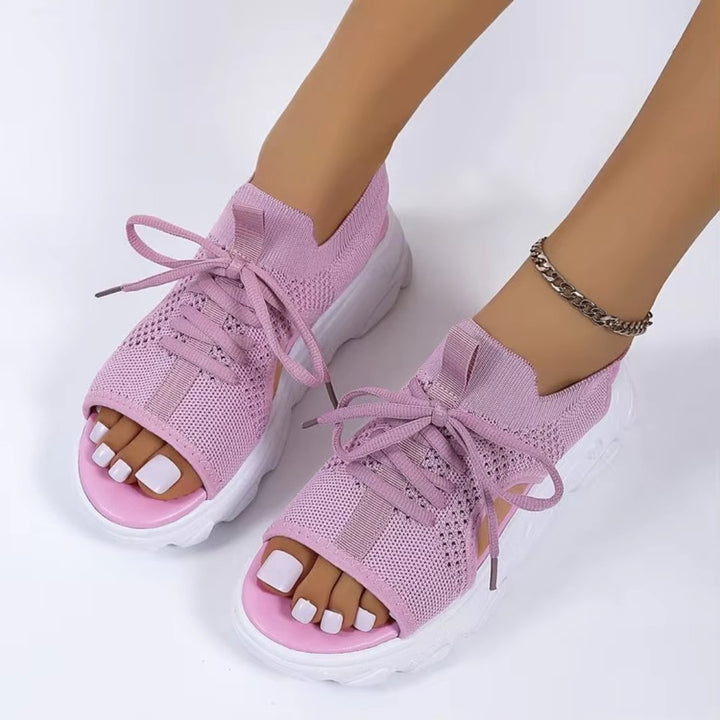 Chic black open-toe platform sandals with adjustable lace-up, ideal comfortable footwear for women.