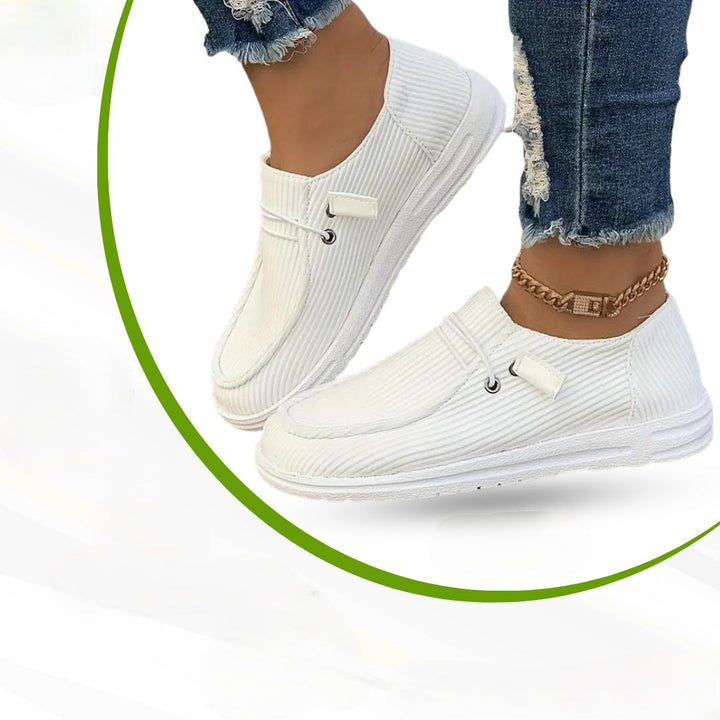 Orthopedic slip-on shoes for women, featuring ergonomic design & arch support, ideal for leisure & walking comfort.