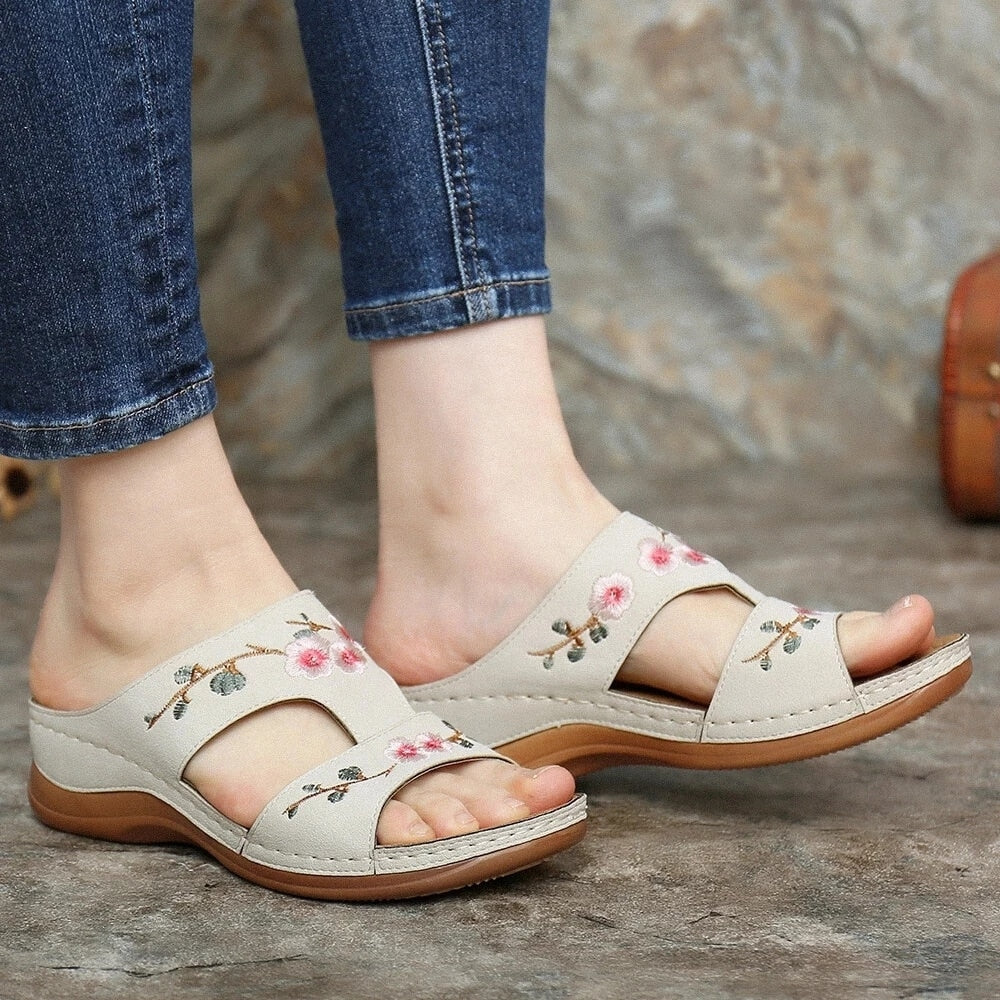 Women's comfort footwear: orthopedic floral sandals with arch support & cushioned sole.
