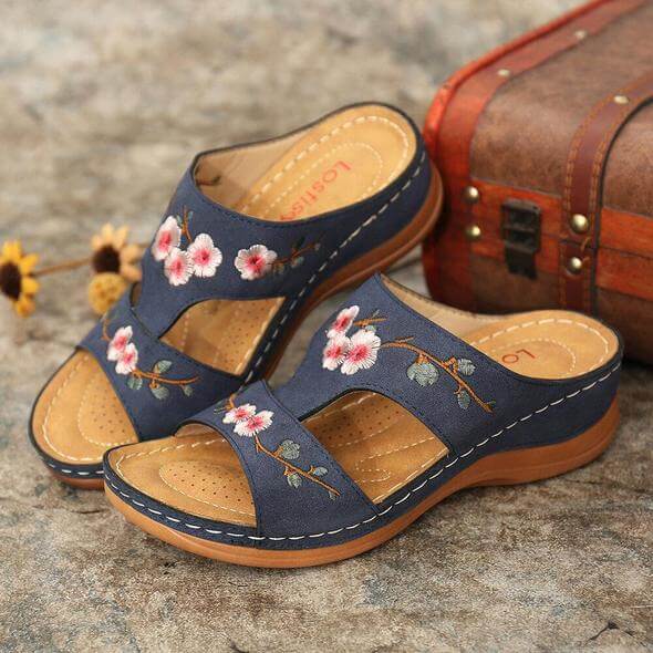 Orthopedic women's sandals, featuring a floral design & arch support for all-day comfort.