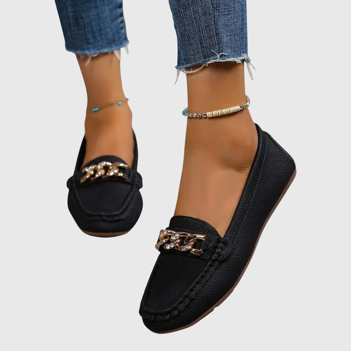 Women's casual orthopedic loafers in a studio shot, emphasizing their comfortable design.