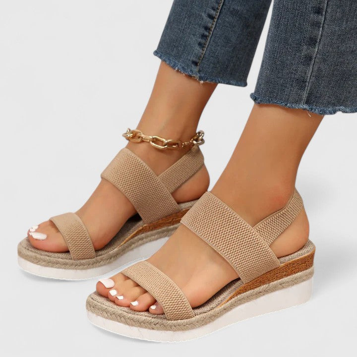 Supportive women's orthopedic open-toe wedge sandals with arch support for comfortable walking & foot health.