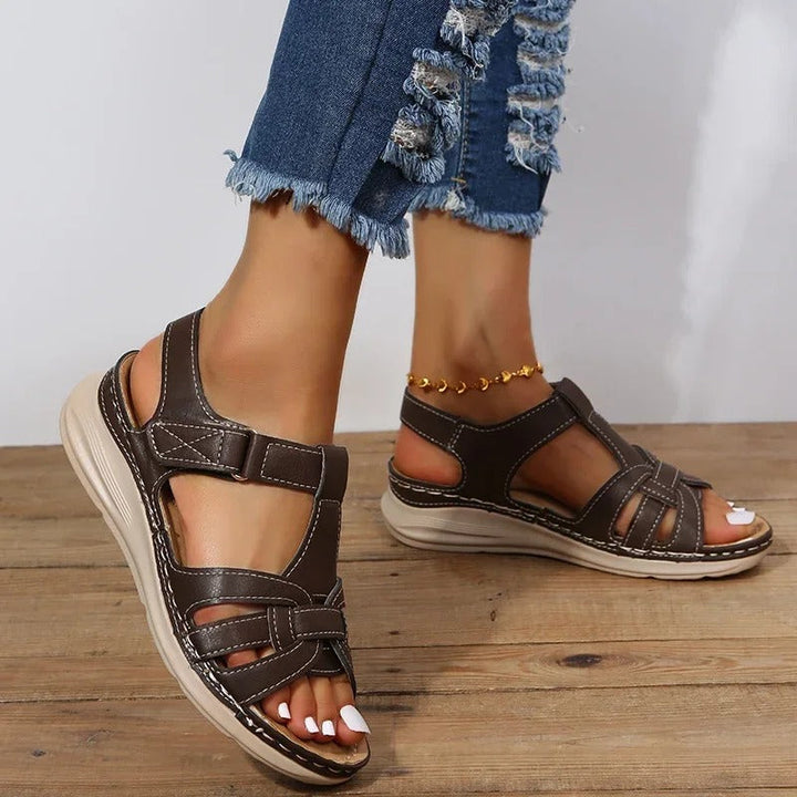 Chic women's orthopedic sandals with adjustable straps, providing custom comfort & support for walking.