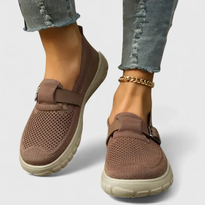 Supportive women's flats, orthopedic loafers providing foot support and comfort for extended walking.