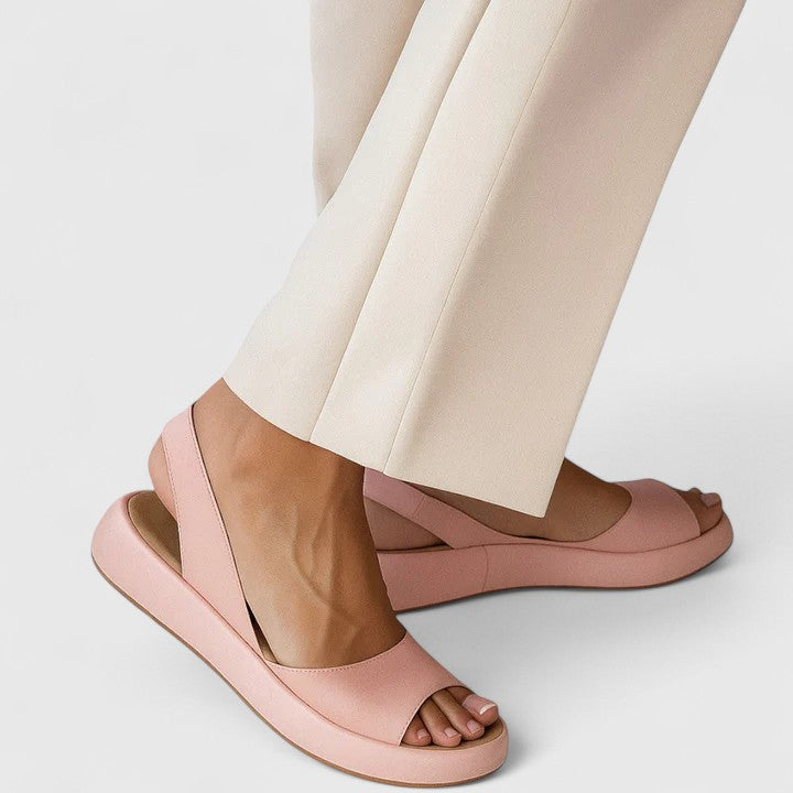 Women's orthopedic slip-on sandals with cushioned comfort & arch support for foot pain relief.