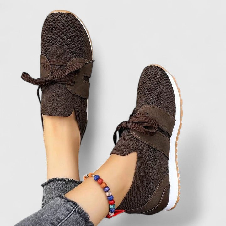 Front view of women's orthopedic walking sneakers, showcasing the comfortable slip-on design.