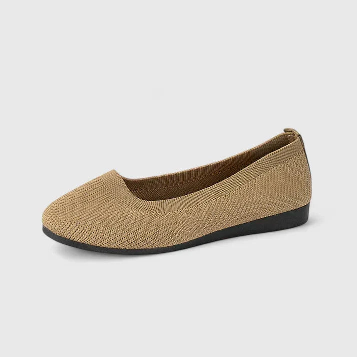 Close-up of the interior of women's orthopedic shoes, highlighting plush cushioning & contoured arch support.