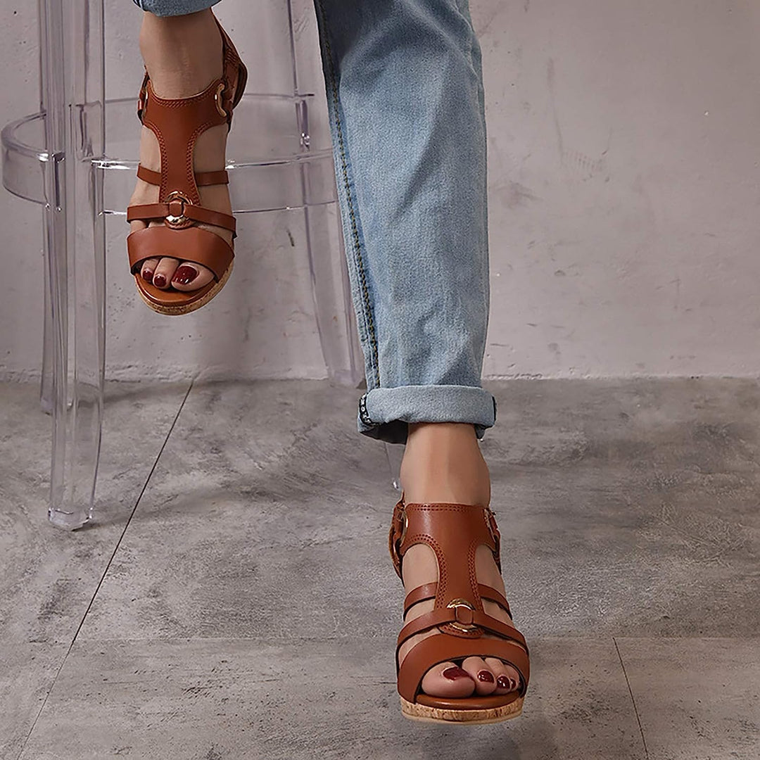 Woman wearing stylish orthopedic wedge sandals, demonstrating comfortable foot support.