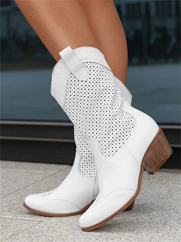 Stylish women's western ankle boots with side zipper, perforated design & block heel.