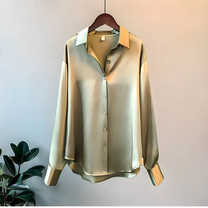 Elegant women's oversized button-down blouse. Long sleeve, relaxed fit, perfect for casual chic or workwear.