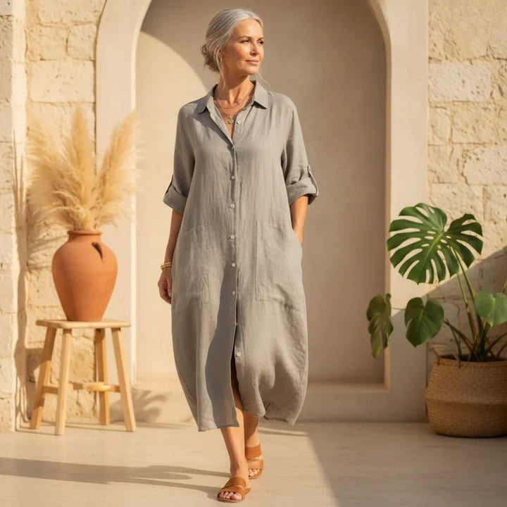 Women's oversized button down midi shirt dress with roll tab sleeves and pockets, perfect for casual summer wear.