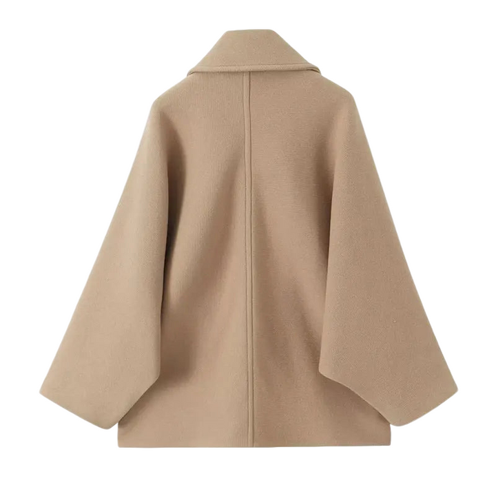 Comfortable oversized women's transitional jacket with button closure for casual style.