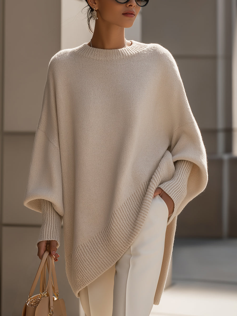 Women's oversized cape sweater with elegant poncho style and batwing sleeves, perfect for autumn fashion.
