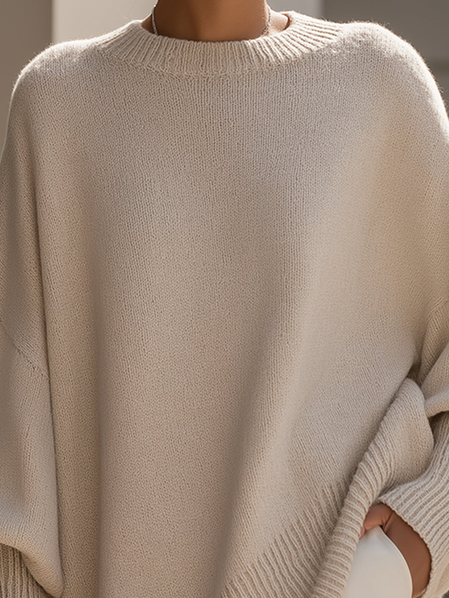 Chic women's oversized sweater, a versatile poncho-style cape with elegant asymmetric design for layering.