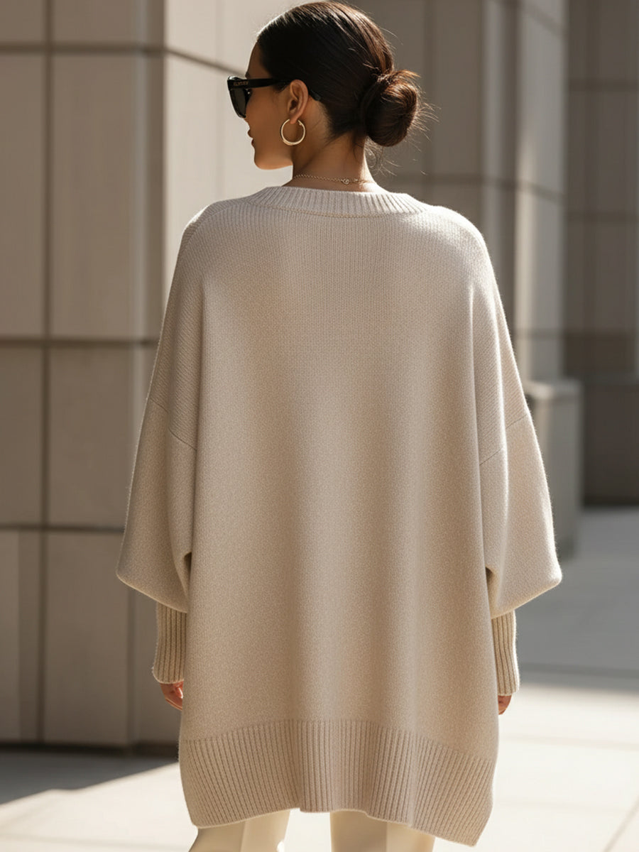 Comfortable women's oversized cape sweater. Elegant poncho style, perfect for versatile autumn layering.