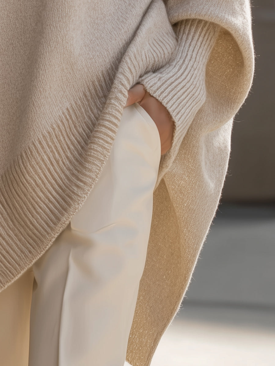 Elegant women's oversized batwing sleeve sweater in a chic poncho style, ideal for autumn fashion.