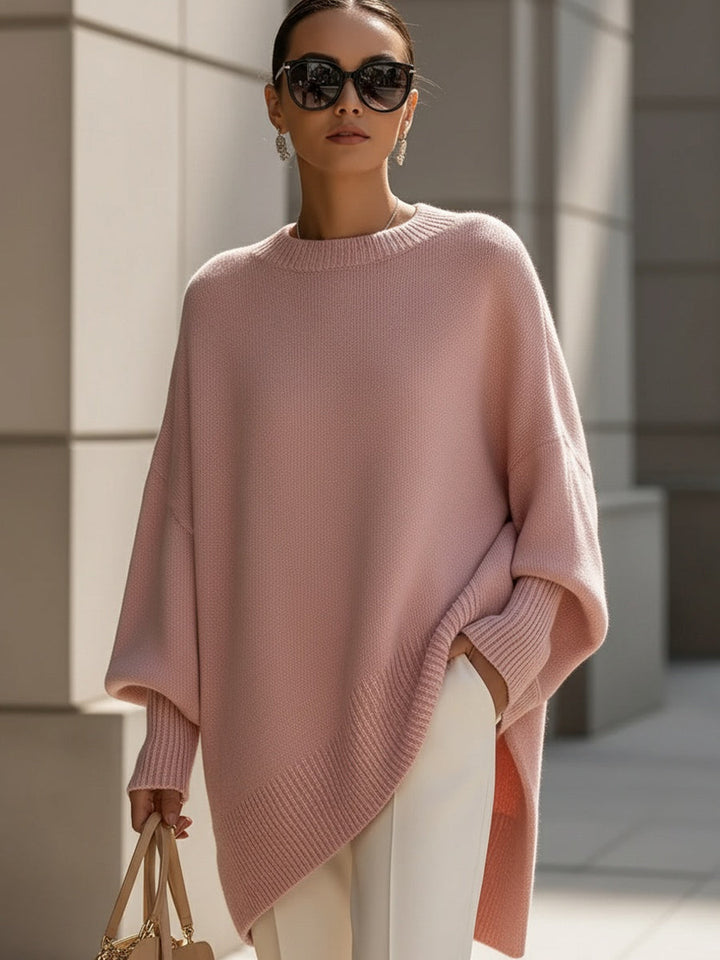 Asymmetric women's oversized cape sweater, a stylish poncho with batwing sleeves for chic autumn layering.