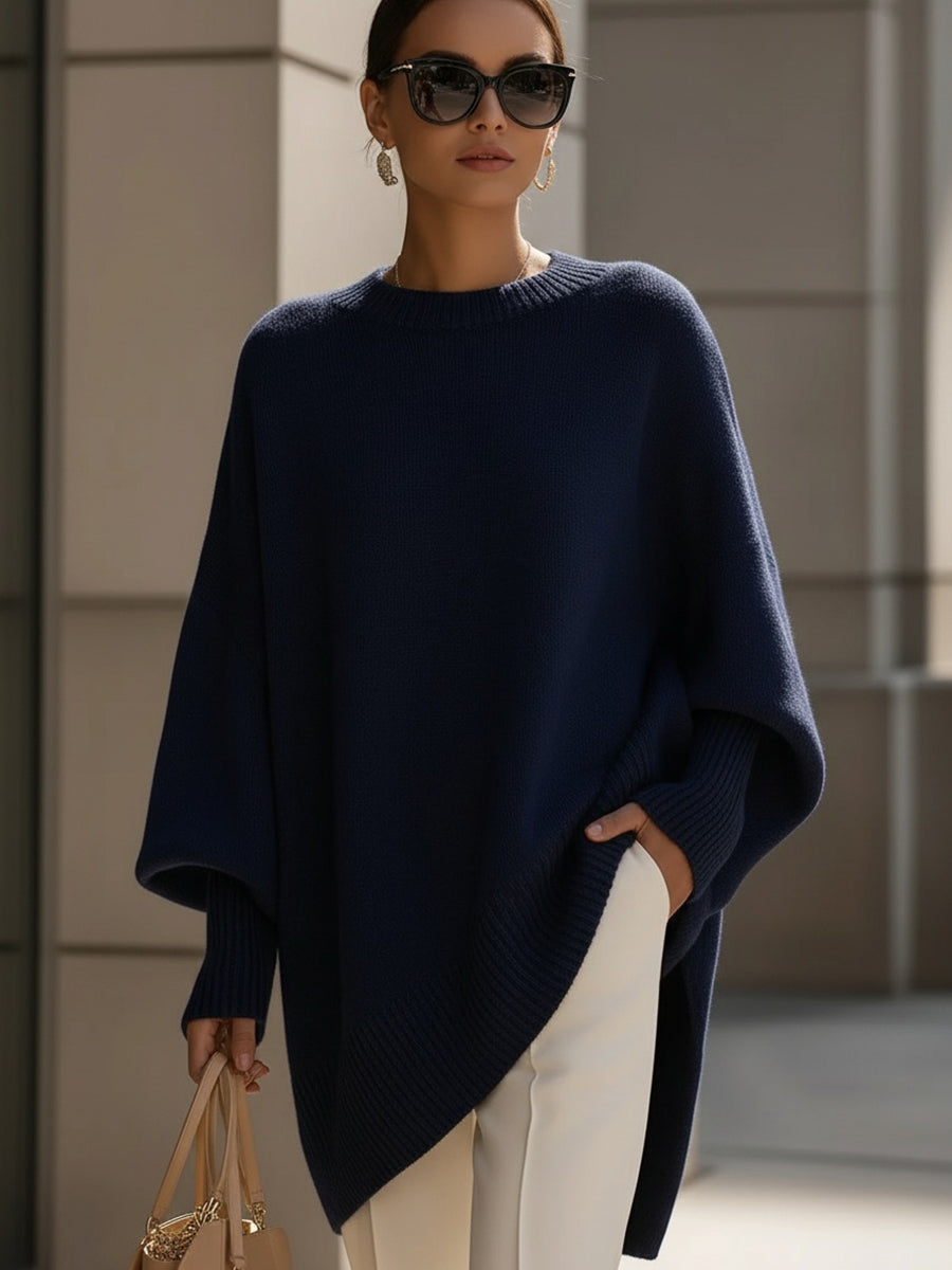 Versatile women's oversized sweater, featuring an elegant cape poncho design and comfortable batwing sleeves.